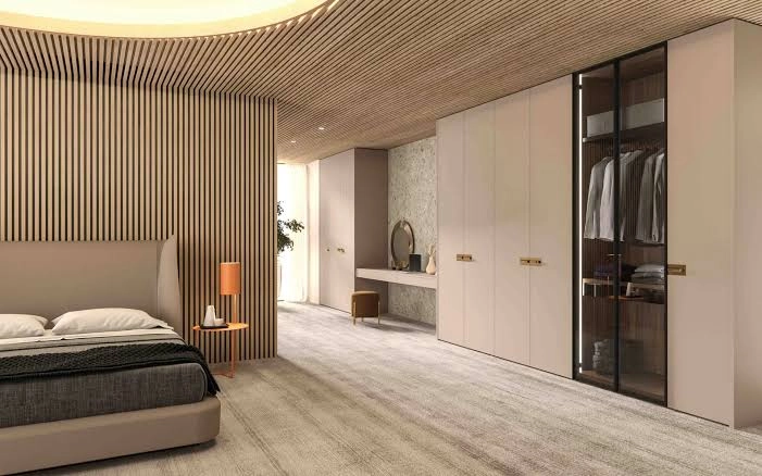 Sliding wardrobe designers in Gurgaon - glass finish wardrobe by Innovante Studio