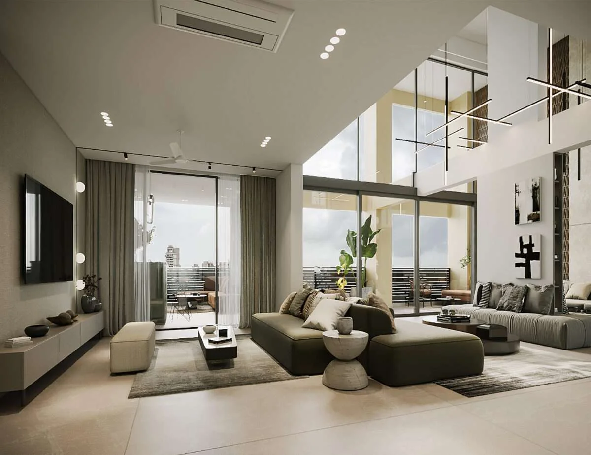   Bright living room with brown leather sofa, beige armchair, yellow throw, and adjacent dining area.