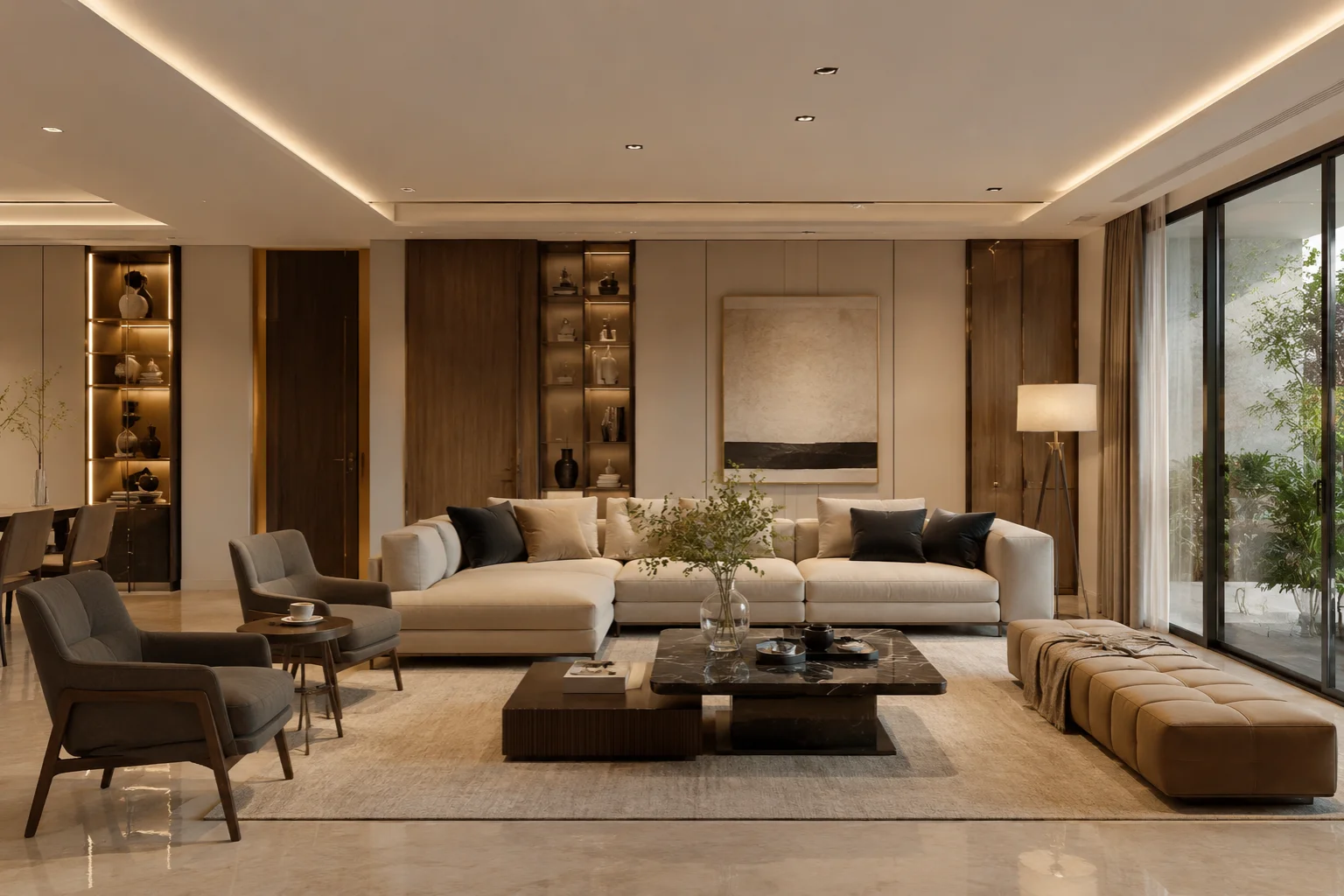   Elegant beige living room with cream sofa, gold lamps, dark round coffee table, and portrait artwork.