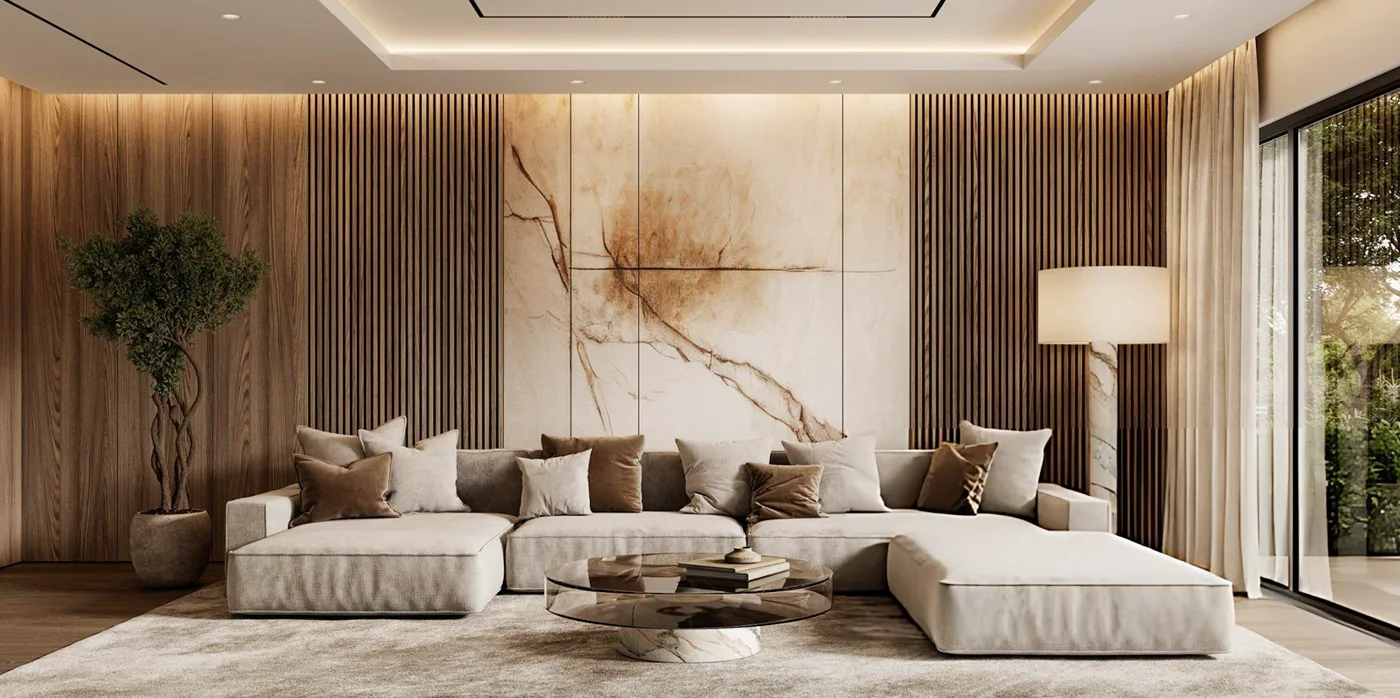   Elegant beige living room with cream sofa, gold lamps, dark round coffee table, and portrait artwork.
